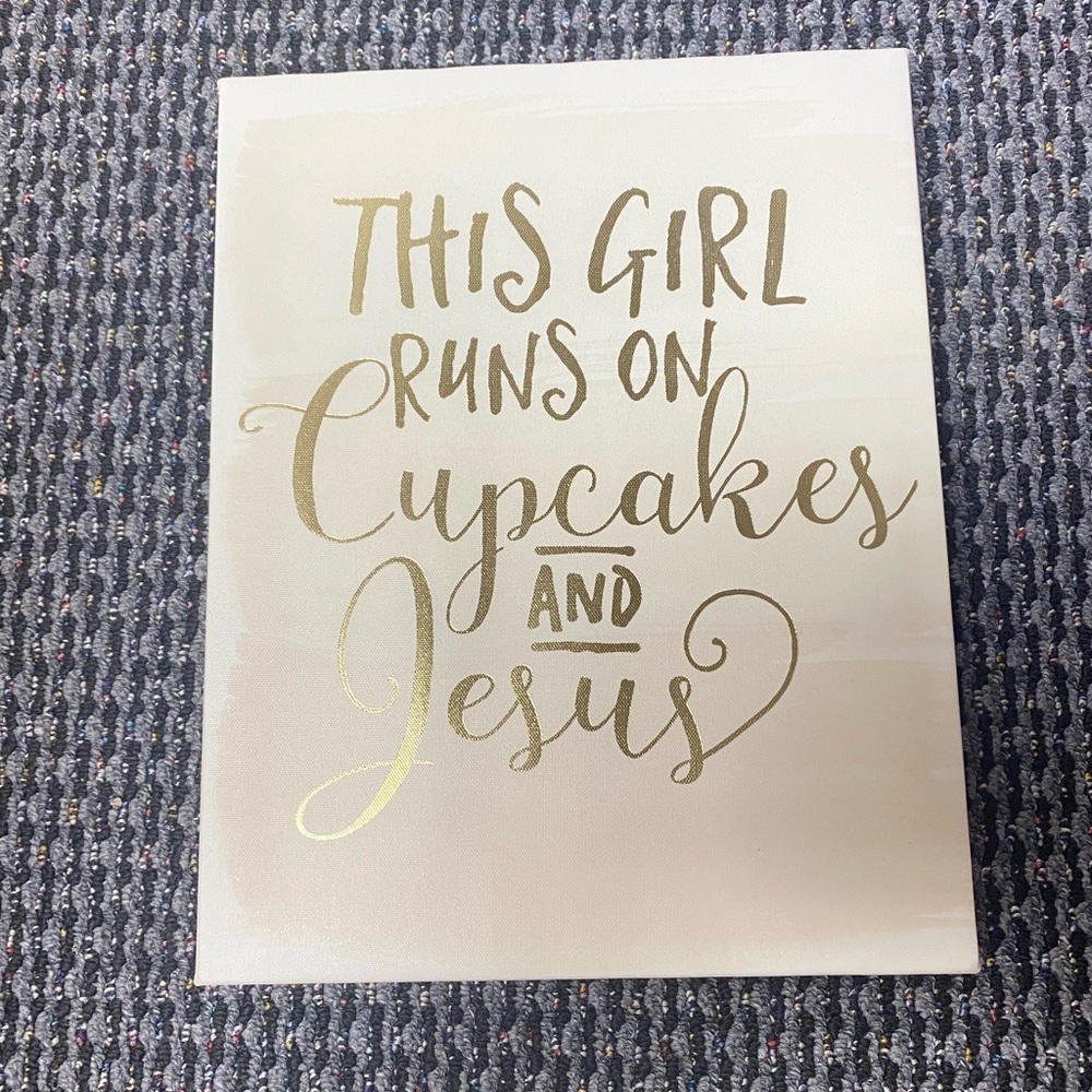Wall sign. “This girls runs on cupcakes and Jesus”. 11” wide, 14” length.